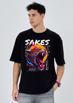 Man wearing a black t-shirt with a colorful graphic design on a light gray background